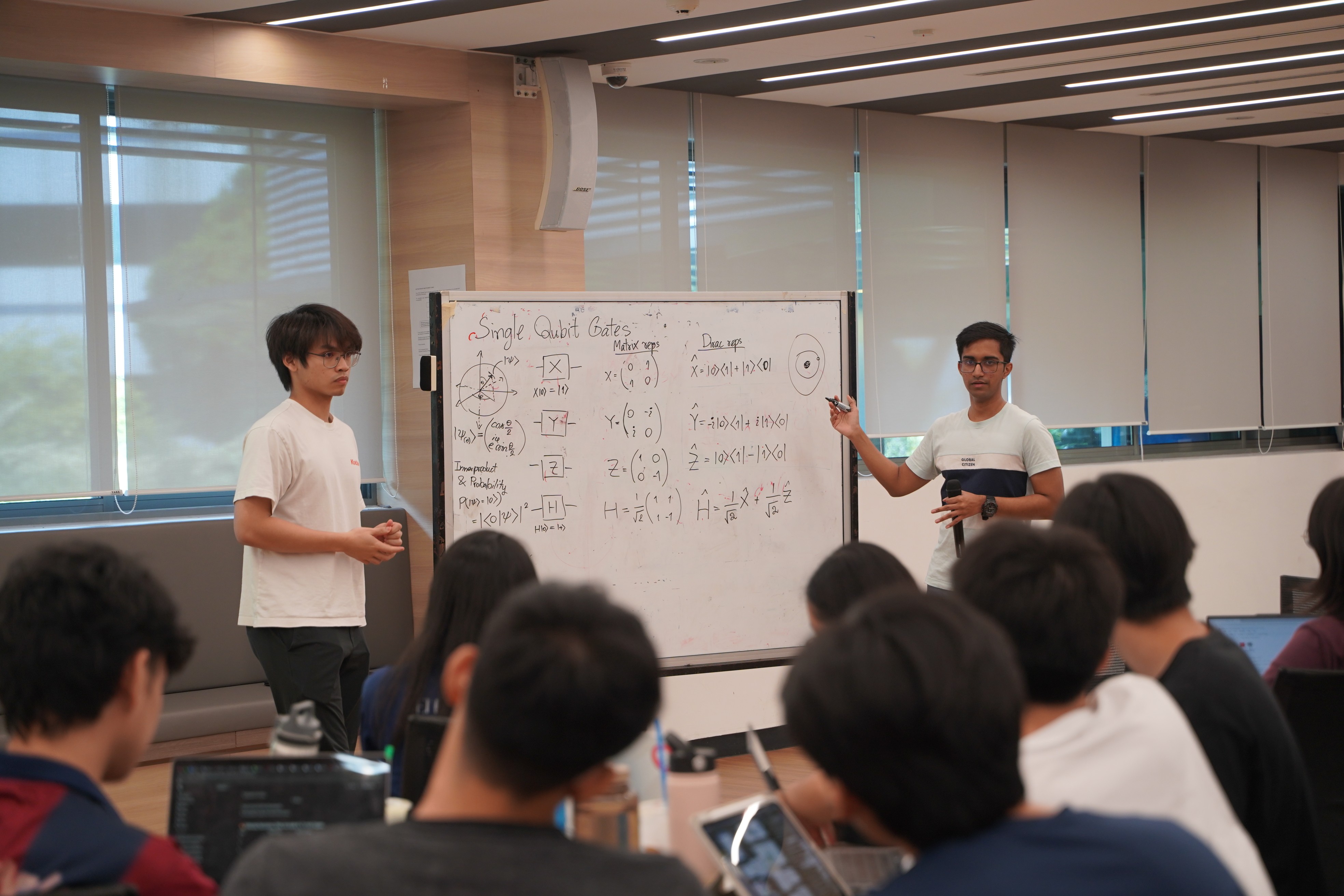In-person workshop session with a whiteboard and attendees